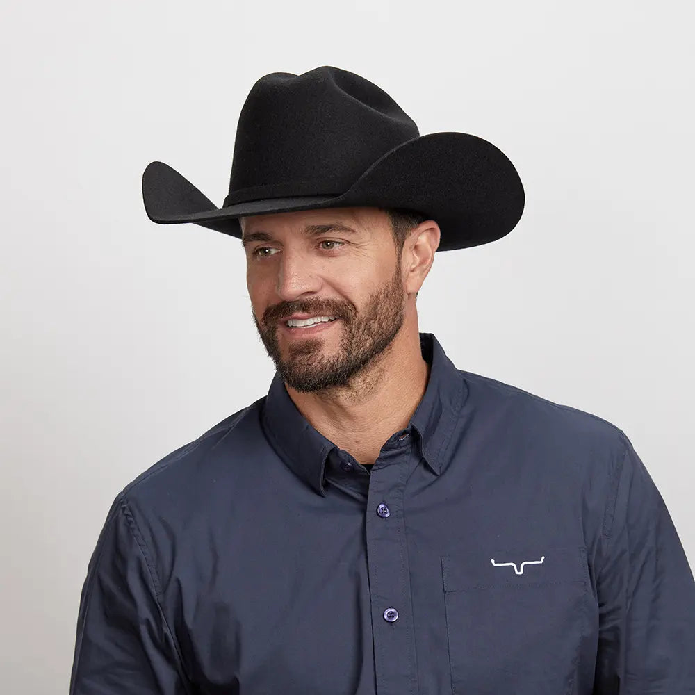 model wearing blue shirt wearing a american hat makers black cattleman cowboy hat