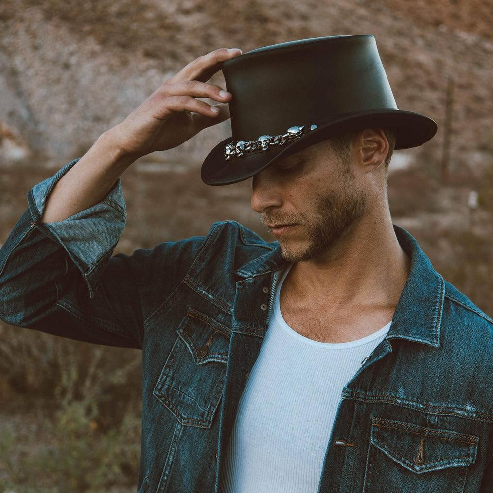 A man in denim jack and El Dorado Black Leather Top Hat