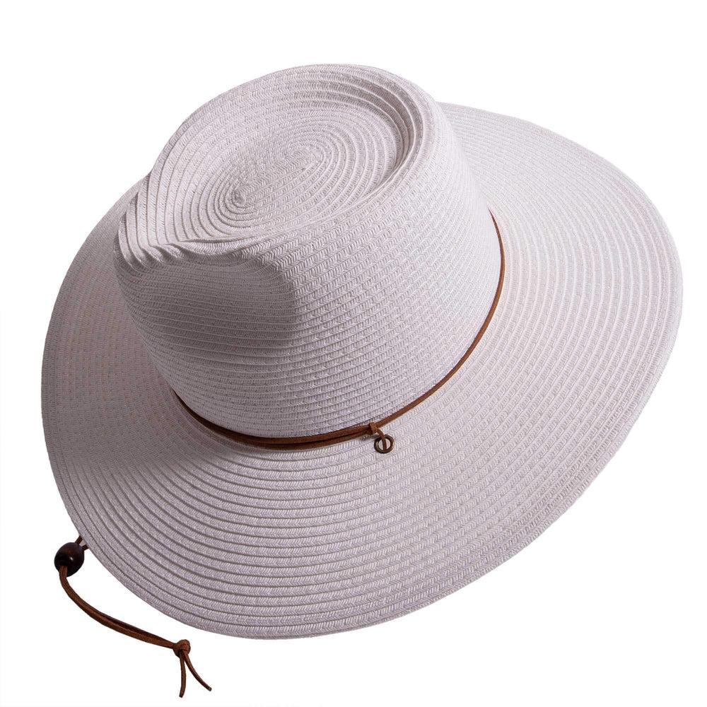 An angle view of Felix white straw sun hat with chinstrap