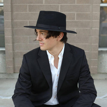 A man wearing Bondi Black Wide Brim Felt Fedora Hat 