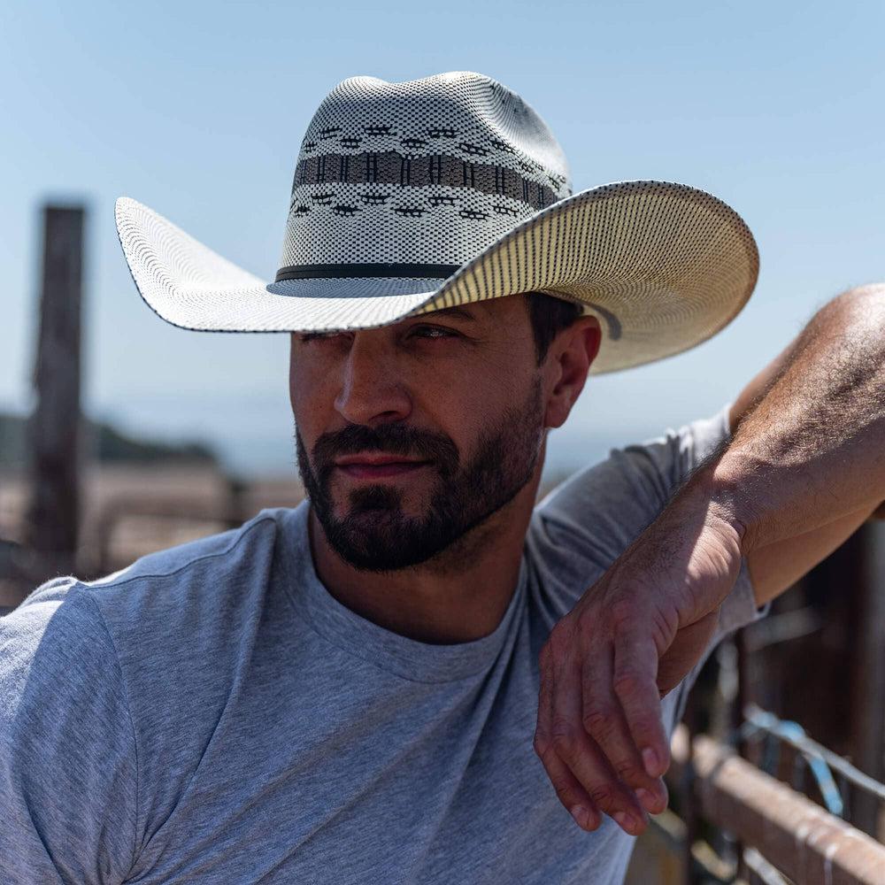 A man wearing shirt and a Cream Wide Brim Straw Hat