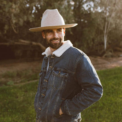 A man in a denim jacket wearing Crescent Oatmeal Felt Wool Fedora Hat 