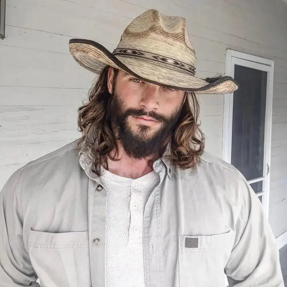 man in tan shirt with a beard wearing a diego palm cowboy hat