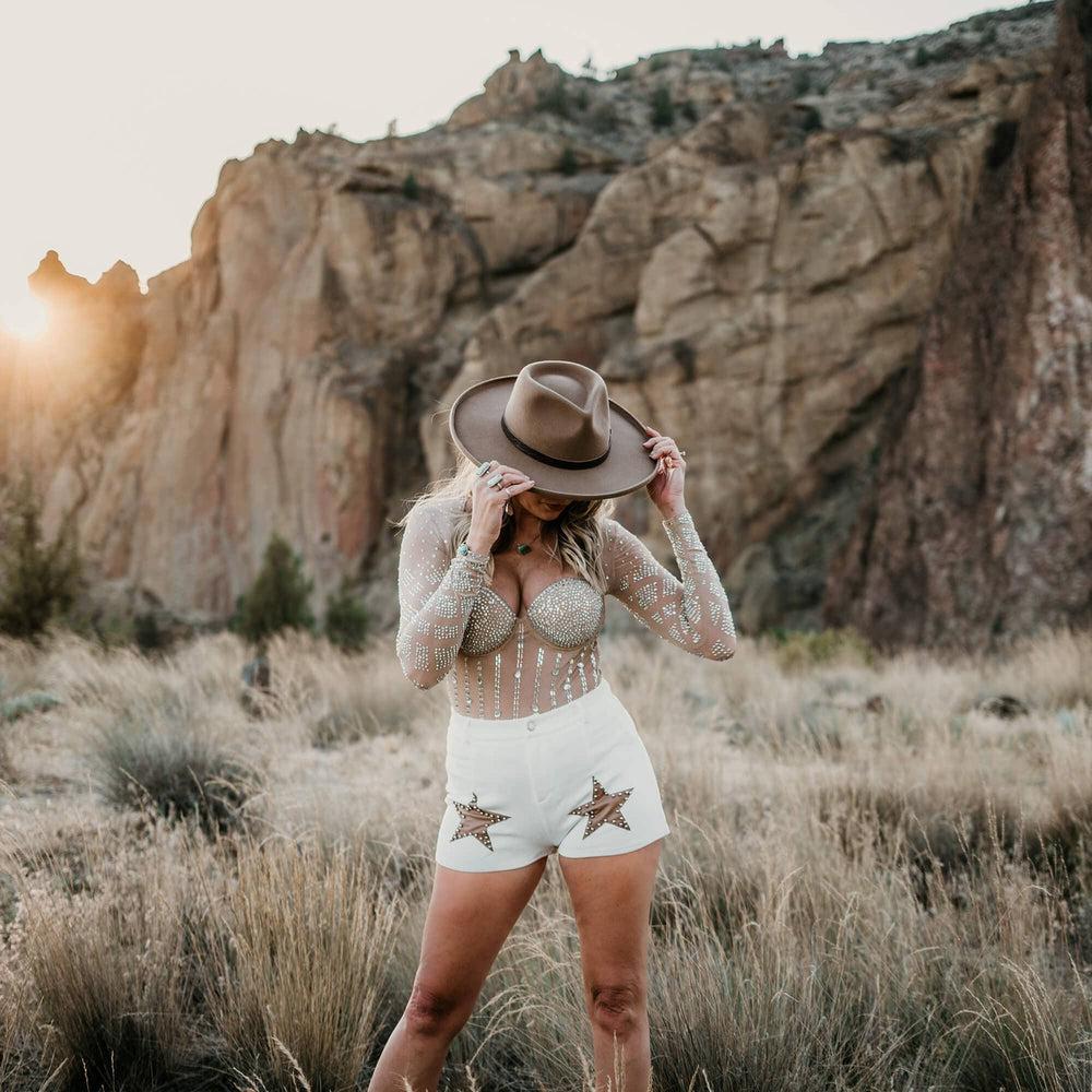 A woman wearing Hudson Bark Felt Fedora Hat