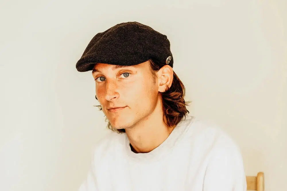 Model C Mens Felt Cap on a man wearing a white sweater