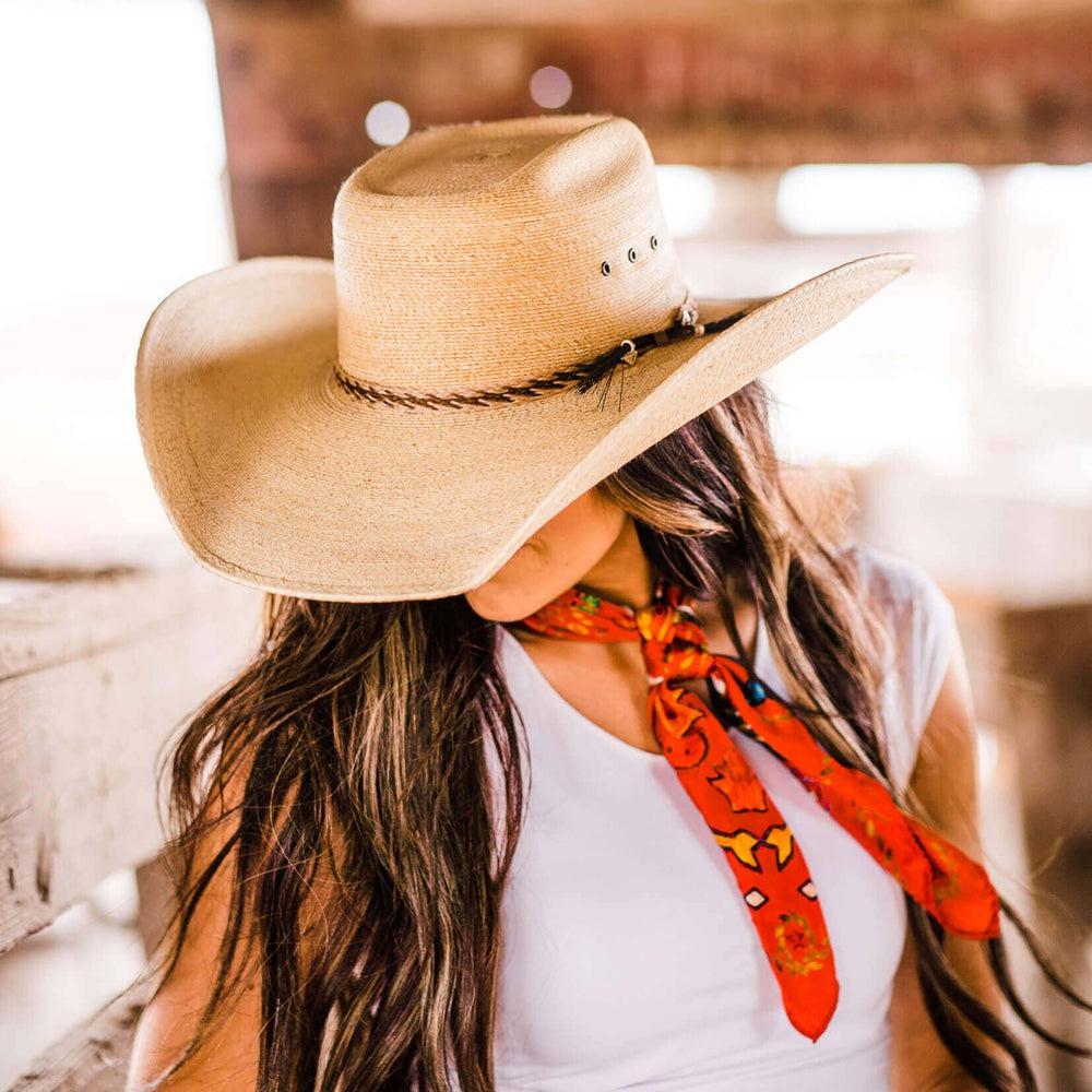 A woman wearing Roper Natural  Palm Straw Hat bon an angle view