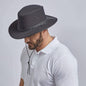 A man wearing Soaker Black Mesh Sun Hat