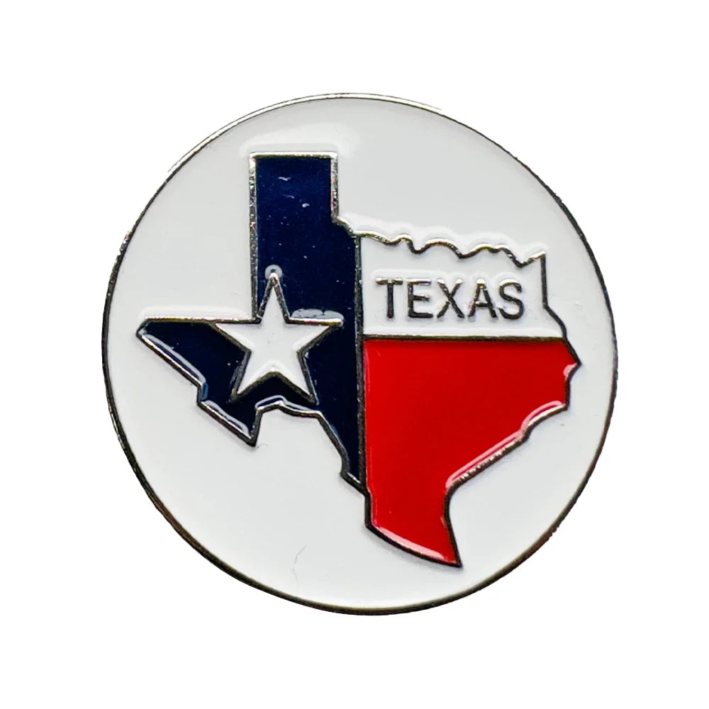 A circular Texas state-shaped enamel pin featuring the Texas flag colors: a blue vertical section with a white star, a white section with the word TEXAS, and a red lower section, on a white background.