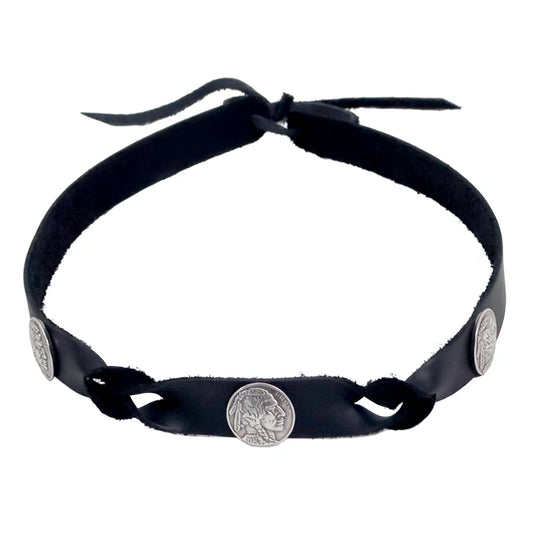 A black faux-leather headband with three silver coin-style metal studs featuring Native American head profiles, shown against a plain white background.