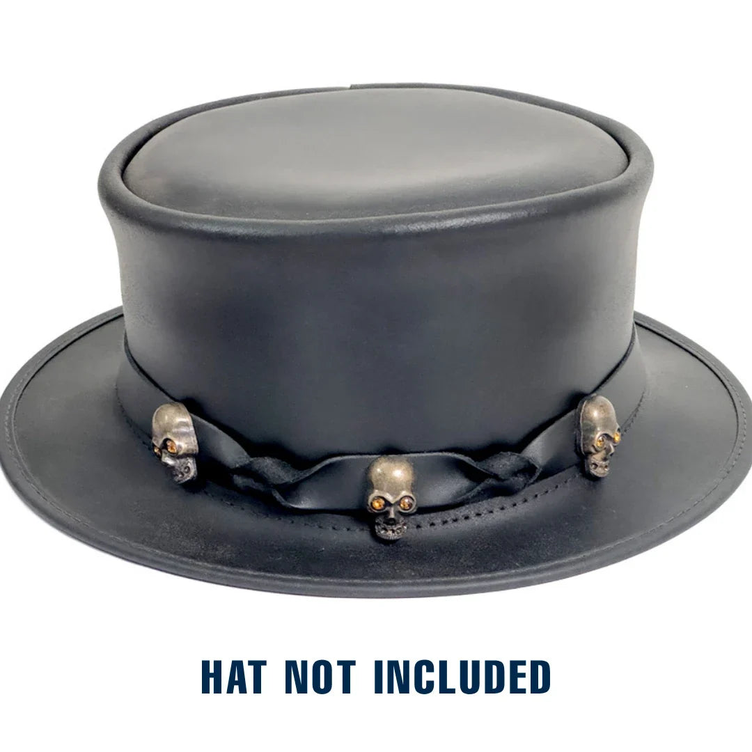 A black leather top hat with a decorative black ribbon and metallic skull embellishments on the band, shown on a white background with the text 'HAT NOT INCLUDED' below.