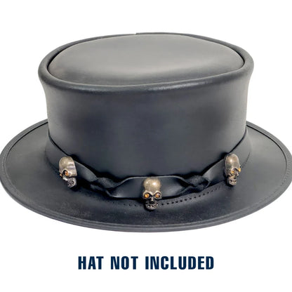 A black leather top hat with a decorative black ribbon and metallic skull embellishments on the band, shown on a white background with the text 'HAT NOT INCLUDED' below.