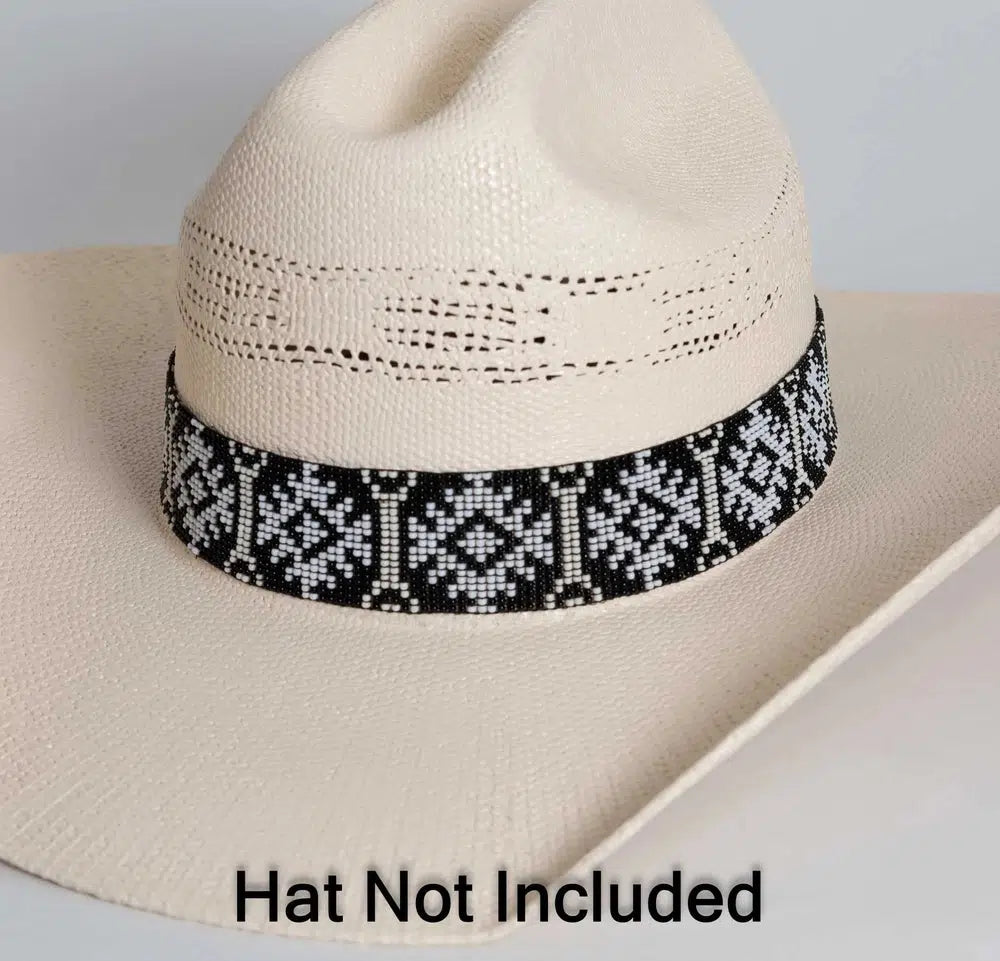 An Angle left view of a white cowboy hat with carson black and white beaded hat band